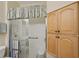 Modern bathroom with glass shower, seat, grab bar, and ample storage cabinets at 2129 Acadia Greens Dr, Sun City Center, FL 33573
