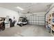 Spacious garage featuring a golf cart and ample storage space at 2129 Acadia Greens Dr, Sun City Center, FL 33573