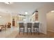 Kitchen featuring bar seating, seamlessly blending into dining and living spaces, promoting connectivity at 2129 Acadia Greens Dr, Sun City Center, FL 33573