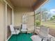 Screened lanai featuring outdoor furniture and calming accents at 2129 Acadia Greens Dr, Sun City Center, FL 33573