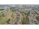Aerial view of the community with golf course and lakes in the background at 2243 Worthington Greens Dr, Sun City Center, FL 33573