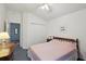 Bright bedroom with a double bed, closet, and natural light at 2243 Worthington Greens Dr, Sun City Center, FL 33573