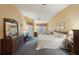 Large main bedroom offering a ceiling fan, furnishings, and natural light at 2243 Worthington Greens Dr, Sun City Center, FL 33573