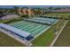 Aerial view of community shuffleboard courts, offering a fun outdoor activity and recreation space at 2243 Worthington Greens Dr, Sun City Center, FL 33573