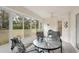 Inviting sunroom with large windows offering scenic views of the backyard at 2243 Worthington Greens Dr, Sun City Center, FL 33573