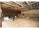 View of a barn interior with sturdy posts and beams, and ample open area at 25590 Olympia Rd, Brooksville, FL 34601