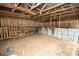 Interior of a barn displaying open rafters, wood paneling, and ample space for equipment or livestock at 25590 Olympia Rd, Brooksville, FL 34601