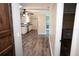 Open-concept kitchen with white cabinets and updated flooring, offering both style and functionality at 25590 Olympia Rd, Brooksville, FL 34601