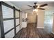 Well-lit kitchen featuring white cabinets, stainless steel appliances, and modern flooring at 25590 Olympia Rd, Brooksville, FL 34601