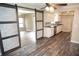 Modern kitchen with white cabinets, stainless appliances, and open access to the living area, perfect for entertaining at 25590 Olympia Rd, Brooksville, FL 34601