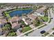 Beautiful aerial view of suburban homes on manicured lawns near a tranquil lake in a vibrant community at 30280 Southernwood Ct, Wesley Chapel, FL 33543
