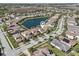 Real estate listing with a house location pin-drop in a charming neighborhood by a lake at 30280 Southernwood Ct, Wesley Chapel, FL 33543