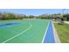 Community basketball court surrounded by lush landscaping and mature trees for enjoyable recreation at 30280 Southernwood Ct, Wesley Chapel, FL 33543