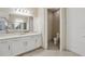 Bathroom featuring a double sink vanity and separate water closet at 30280 Southernwood Ct, Wesley Chapel, FL 33543