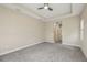 Large bedroom features a ceiling fan and access to the Primary bathroom at 30280 Southernwood Ct, Wesley Chapel, FL 33543