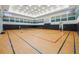 Indoor sports court with basketball hoops and pickleball net for active recreation at 30280 Southernwood Ct, Wesley Chapel, FL 33543
