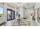 Elegant lobby with high ceilings, decorative tile flooring, and a view of the exterior at 30280 Southernwood Ct, Wesley Chapel, FL 33543