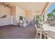 Covered outdoor bar with seating and views of the pool and surrounding area at 30280 Southernwood Ct, Wesley Chapel, FL 33543