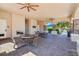Covered patio area with tables and chairs, perfect for outdoor dining at 30280 Southernwood Ct, Wesley Chapel, FL 33543