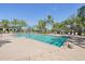 Spacious pool area with palm trees and comfortable lounge chairs for relaxation at 30280 Southernwood Ct, Wesley Chapel, FL 33543