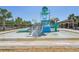 Community water park featuring slides and splash zone under clear blue sky for Gathering fun at 30280 Southernwood Ct, Wesley Chapel, FL 33543