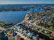 Stunning aerial view of a waterfront community with canals leading to a bay at 315 Manatee Ln, Tarpon Springs, FL 34689
