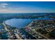 Scenic aerial shot of a lakefront community, featuring waterfront homes, canals, and lush landscaping at 315 Manatee Ln, Tarpon Springs, FL 34689