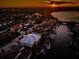 Sunset aerial view of waterfront homes along a canal, each with private docks and boats at 315 Manatee Ln, Tarpon Springs, FL 34689