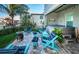 Backyard patio with outdoor seating, a hot tub, and water views, perfect for relaxation and entertaining at 315 Manatee Ln, Tarpon Springs, FL 34689