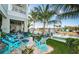 Backyard patio with seating, waterfront access, and lush landscaping, perfect for enjoying the outdoors at 315 Manatee Ln, Tarpon Springs, FL 34689