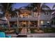 Expansive two-story home with a spacious backyard, waterfront dock, and outdoor living, ideal for entertaining and relaxation at 315 Manatee Ln, Tarpon Springs, FL 34689