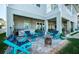 Outdoor patio area with seating, a hot tub, and a beautifully designed backyard space at 315 Manatee Ln, Tarpon Springs, FL 34689