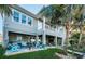 Spacious backyard features an outdoor seating area and a well-maintained lawn and landscaping at 315 Manatee Ln, Tarpon Springs, FL 34689