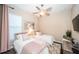 Bedroom with twin beds, soft lighting, and cozy decor, perfect for a guest room or room at 315 Manatee Ln, Tarpon Springs, FL 34689