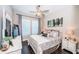 Bedroom featuring a large window and a bed with decorative pillows and a large dresser at 315 Manatee Ln, Tarpon Springs, FL 34689