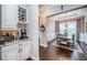 Inviting dining area featuring a chandelier and open access to a bar with granite counters at 315 Manatee Ln, Tarpon Springs, FL 34689