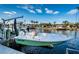 Dock featuring a boat lift, offering convenience for boating enthusiasts with scenic waterfront views and easy access at 315 Manatee Ln, Tarpon Springs, FL 34689