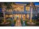 Elegant waterfront home with a spacious patio and lush landscaping at 315 Manatee Ln, Tarpon Springs, FL 34689