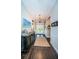 Inviting foyer with dark wood floors, stylish lighting, and elegant decor at 315 Manatee Ln, Tarpon Springs, FL 34689