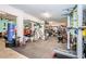 Spacious garage featuring a home gym, car, and ample storage, perfect for fitness enthusiasts and hobbyists at 315 Manatee Ln, Tarpon Springs, FL 34689