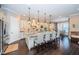 Bright, modern kitchen features a large island with seating and an open layout to the breakfast nook at 315 Manatee Ln, Tarpon Springs, FL 34689