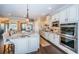 Well-equipped kitchen featuring stainless steel appliances, a large island with seating, and custom cabinetry at 315 Manatee Ln, Tarpon Springs, FL 34689