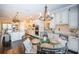 Spacious kitchen and breakfast nook combination with stainless appliances, white cabinets and a large island at 315 Manatee Ln, Tarpon Springs, FL 34689