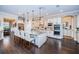 Gourmet kitchen with stainless appliances, large island and breakfast bar seating at 315 Manatee Ln, Tarpon Springs, FL 34689
