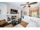 Cozy living room with stone fireplace, wood planked wall and view of the entryway at 315 Manatee Ln, Tarpon Springs, FL 34689