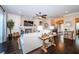 Open-concept living room with fireplace, hardwood floors, and stylish furnishings at 315 Manatee Ln, Tarpon Springs, FL 34689