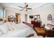 Large main bedroom featuring dark wood floors, a fan, and sitting area at 315 Manatee Ln, Tarpon Springs, FL 34689