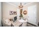 Bright home office featuring a rustic desk, comfortable chair, stylish decor and modern lighting at 315 Manatee Ln, Tarpon Springs, FL 34689