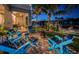 Inviting waterfront patio with comfortable seating and views of the canal and boat dock at 315 Manatee Ln, Tarpon Springs, FL 34689