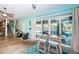Bright recreation room with a modern bar area and a view of the canal at 315 Manatee Ln, Tarpon Springs, FL 34689